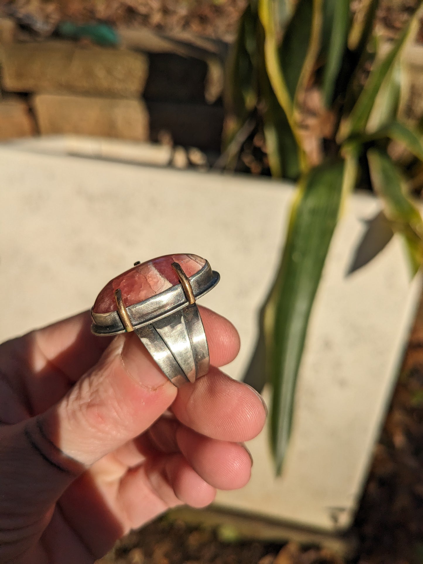 Rhodochrosite ring with bronze setting